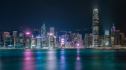 Obraz premium Commercial Building With Water Reflection In Victoria Harbor At Night On October 8, 2018