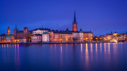 Scenic view of the old town by night with Gamla Stan and Riddarholmen islands, Stockholm, Sweden