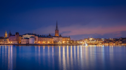 Scenic view of the old town by night with Riddarholmen, Gamla Stan and Sodermalm islands, Stockholm, Sweden
