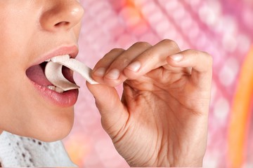 Close up on a beautiful girl while enjoying  gum