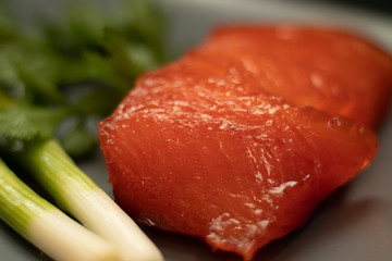 Smoked salmon and fresh scallions, close-up