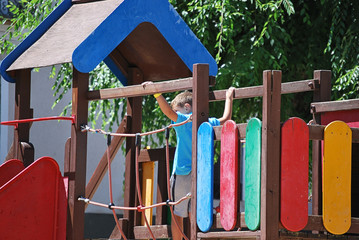 Playground with the child crossing the bridge.