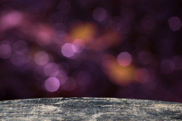 Background with empty wooden surface and purple bokeh