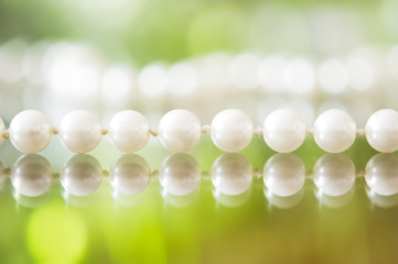 White pearl necklace. Selective focus and shallow depth of field.
