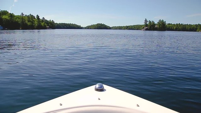 The bow of a speedboat cruising on Lake Joseph, Ontario.