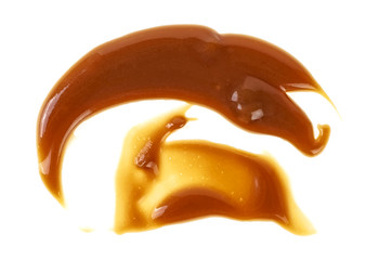 Delicious caramel cream on white background, top view.