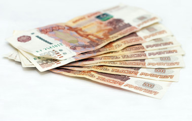 Obraz na płótnie Canvas Scattered Russian 5000 rubles banknotes closeup