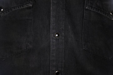 Black washed faded jeans texture with seams, clasps, buttons and rivets