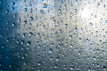 background of raindrops on window glass, close up