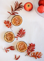 Mini apple cakes with cup of coffee. Enjoy autumn, colors. Keep memories of this autumn. Decorate leafs