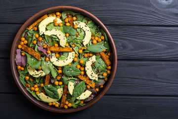 Baby spinach salad with sweet potato , chickpeas and avocado