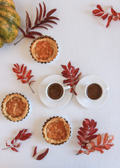 Mini apple cakes with cup of coffee. Enjoy autumn, colors. Keep memories of this autumn. Decorate leafs