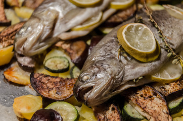 Baken trout with lemon on bed of potatoes