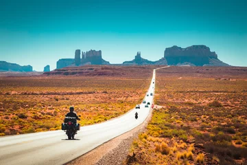 Acrylic prints Route 66 Biker on Monument Valley road at sunset, USA