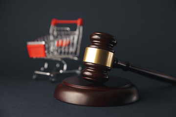 gavel hammer and a shopping cart on the white background