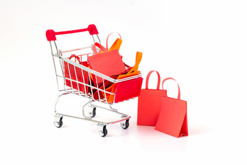 Shopping  bag full on shopping cart on white background.
