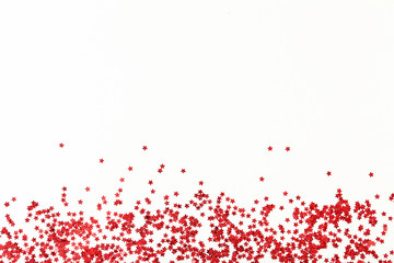 Red confetti on white background