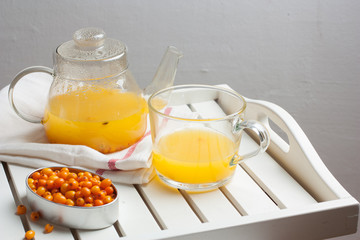 Berry tea with a fresh sea-buckthorn