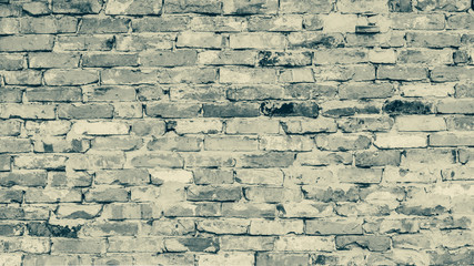 Old grunge brick wall texture wallpaper background. Monochrome image with copy space.