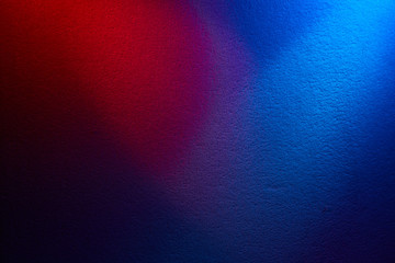 Blue and red background with white glow in the middle