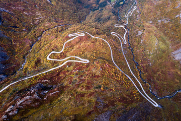 Aerial Drone Panorama view of Winding Road in Norway Scandinavia with Cars and Trees in Fall Autumn