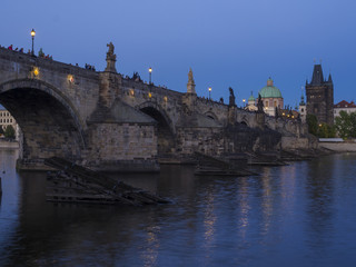 View of iluminated Charles Bridge in from Kampa, Czech Republic. Gothic Charles Bridge is one of the most visited sights in Prague. Architecture and landmark of Prague, night blue hour after sunset
