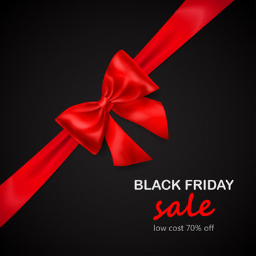 Red bow with diagonally ribbon with shadow and inscription Black Friday Sale on black background