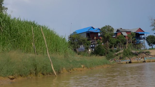 traveling on the channels of a floating village in Cambodia