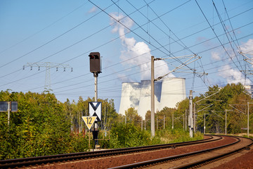 Railroad to a power plant, nature and industry concept.