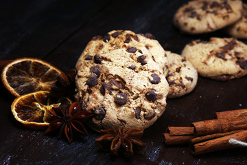 Obraz na płótnie Canvas Chocolate cookies on rustic table. Chocolate chip cookies shot