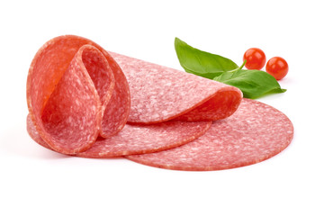 Italian smoked salami sausage slices with basil leaves. Isolated on white background. Close-up.