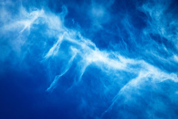 blue sky with white spray cloud