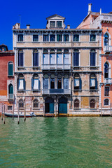 Fototapeta na wymiar Venetian houses by Grand Canal in Venice, Italy