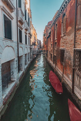 Fototapeta na wymiar Venetian buildings by canal in Venice, Italy