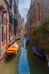 Fototapeta na wymiar Venetian buildings by canal in Venice, Italy