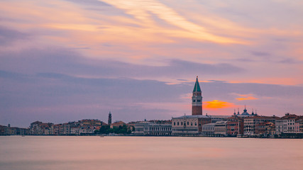 Naklejka premium St. Mark's Bell Tower and the city of Venice, Italy under sunset
