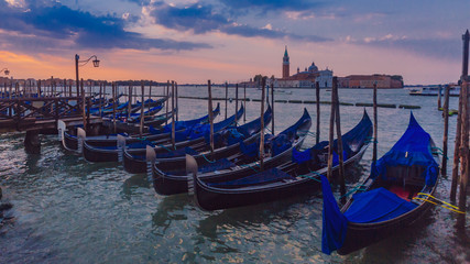Gondolas at sunrise in Venice, Italy