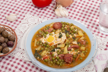 green peas with egg, potatoes and chorizo