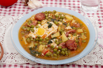 green peas with egg, potatoes and chorizo