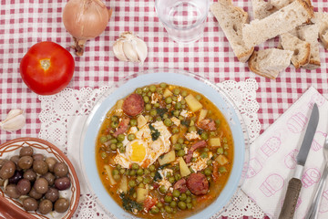 green peas with egg, potatoes and chorizo