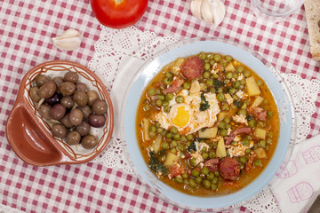green peas with egg, potatoes and chorizo