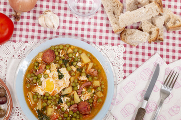 green peas with egg, potatoes and chorizo