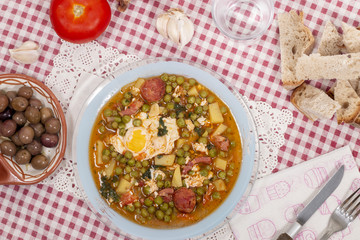 green peas with egg, potatoes and chorizo
