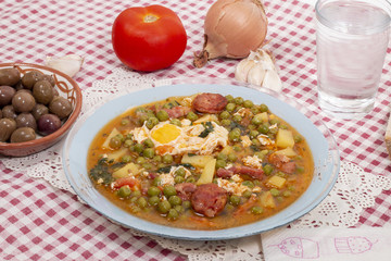 green peas with egg, potatoes and chorizo