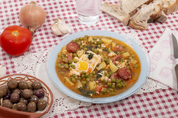 green peas with egg, potatoes and chorizo