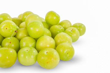 Green plums super fruit, high energy antioxidant food, health booster juicy green mediterranean plums isolated on white background. 