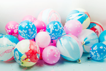 Colorful balloons on pastel color background. Festive or birthday party concept. Flat lay, top view.