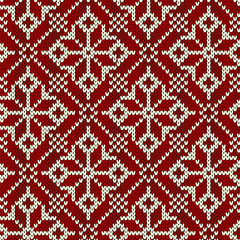Christmas knitting seamless pattern with geometrical snowflakes. Knitted sweater design. Traditional ornamental pattern