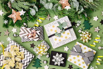 Flat Lay Christmas  Background with Gift boxs, Ribbons and Decorations in Green and Black colors. Flat lay, top view