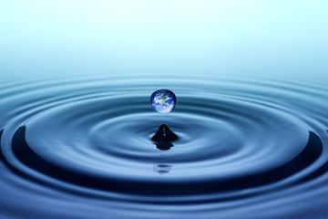 Falling drop of water with earth image
